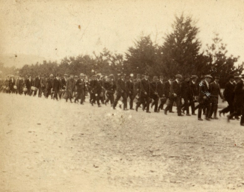Recruits, still dressed in civilian clothes, marching in to Trentham Camp.