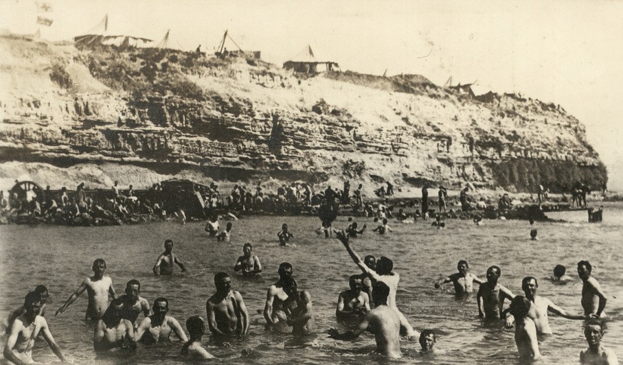 Men bathing, shells dropping occasionally in water off Y Beach, Cape Helles, Gallipoli